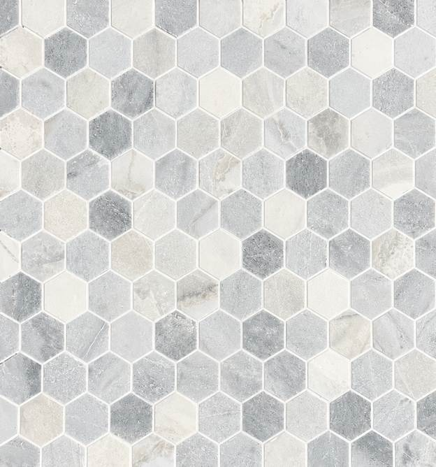 The Blue Horizon 3" Hex Honed Marble Mosaic features blue hexagonal tiles arranged in a honeycomb pattern, creating a geometric, textured surface for an elevated, luxury tile look.