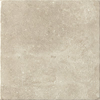The VersaTILE 16x16 Glazed Porcelain Tile in Belgian Light features a square shape, lightly textured matte finish, and subtle shade variations that mimic natural stone for an elegant look.