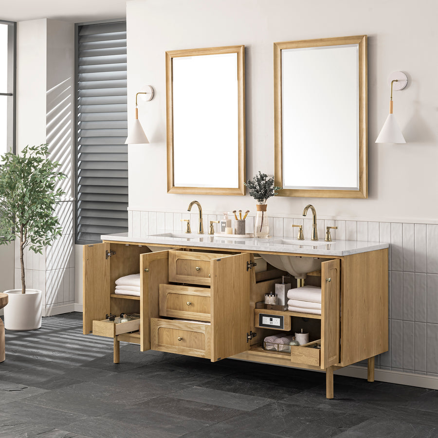 A bathroom with a double sink vanity and two mirrors.