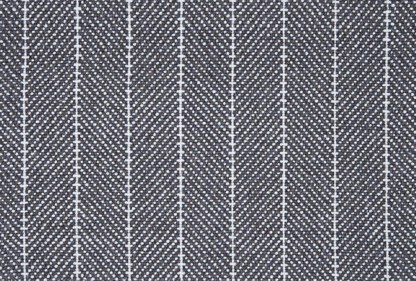 Close-up of Addington Berber Carpet in Charcoal shows a repeating herringbone pattern with thin vertical white lines, creating a zigzag effect reminiscent of premium flooring designs.