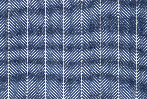 Close-up of Addington Berber Carpet in blue, showing a repeating herringbone pattern with diagonal white dashed zigzags and vertical white edges, evoking the textured look typical of premium Berber carpets.