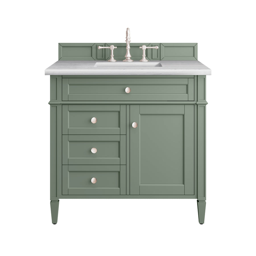 A green bathroom vanity with a white countertop, silver faucet, three side drawers, and one cabinet door, all with round silver knobs, shown against a white background.