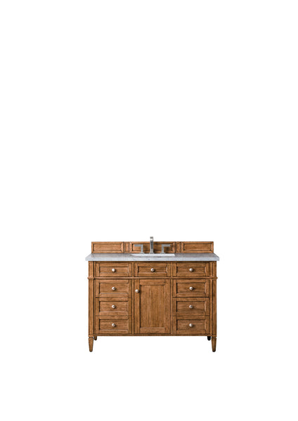 A wooden bathroom vanity with a marble countertop, central sink, silver faucet, and multiple drawers and cabinets for storage, set against a plain white background.