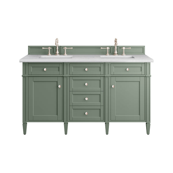 A green double-sink bathroom vanity with a white countertop, two faucets, multiple drawers, and cabinets, all featuring round metal knobs.