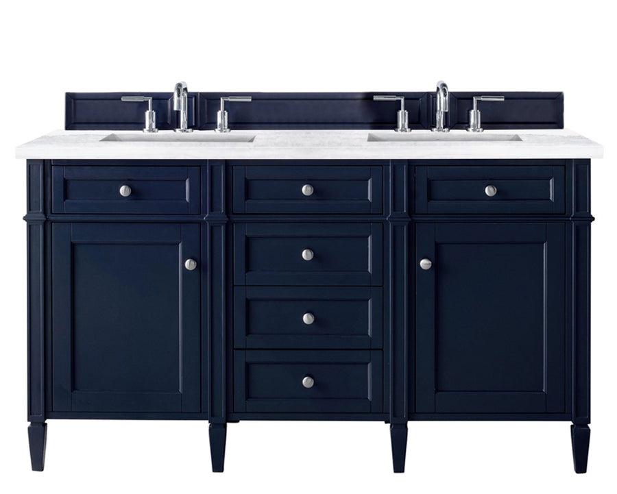 A double-sink bathroom vanity with a white countertop, dark blue cabinets and drawers, silver handles, and two chrome faucets, set against a white background.