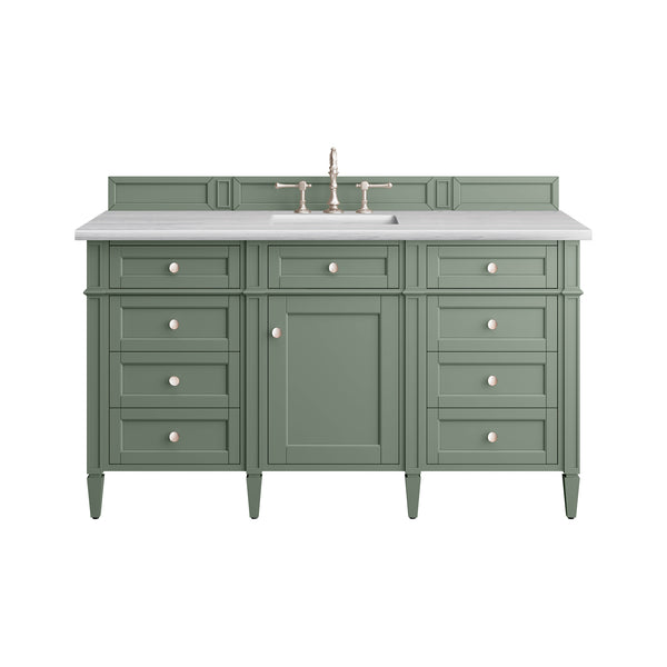 Green bathroom vanity with six drawers, one cabinet door, a white countertop, and a built-in sink with a gold faucet. The design is classic and symmetrical, with round handles on each drawer and door.