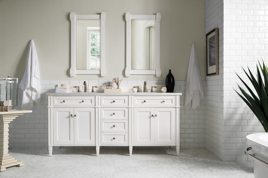 Bright, modern bathroom with a Brittany 72" Double Bowl Vanity, two mirrors above, white subway tile walls, towels on hooks, decor on the countertop, a potted plant, and a window reflecting natural light.