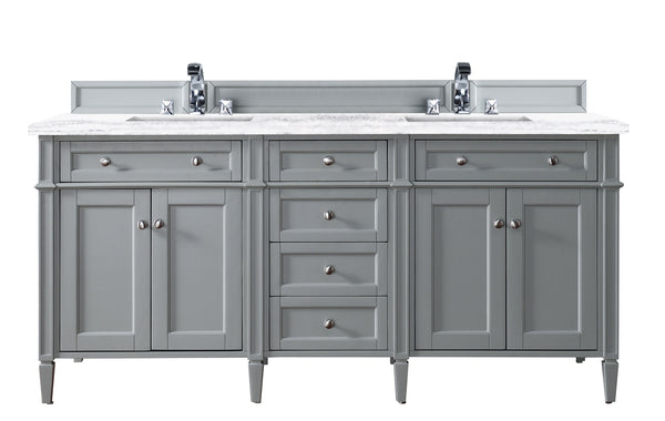 A double-sink gray bathroom vanity with a white countertop, two faucets, four cabinet doors, and five drawers, all with silver knobs.
