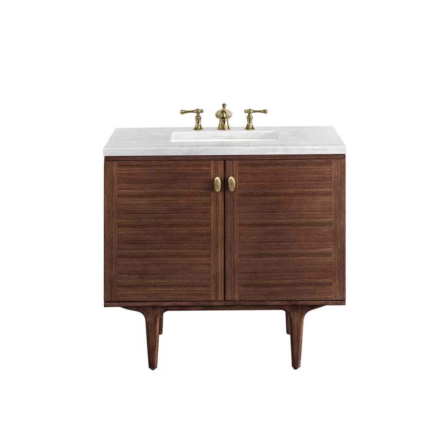 A modern bathroom vanity with a wooden cabinet, two gold handles, a white countertop, an inset sink, and gold faucet fixtures, shown against a plain white background.
