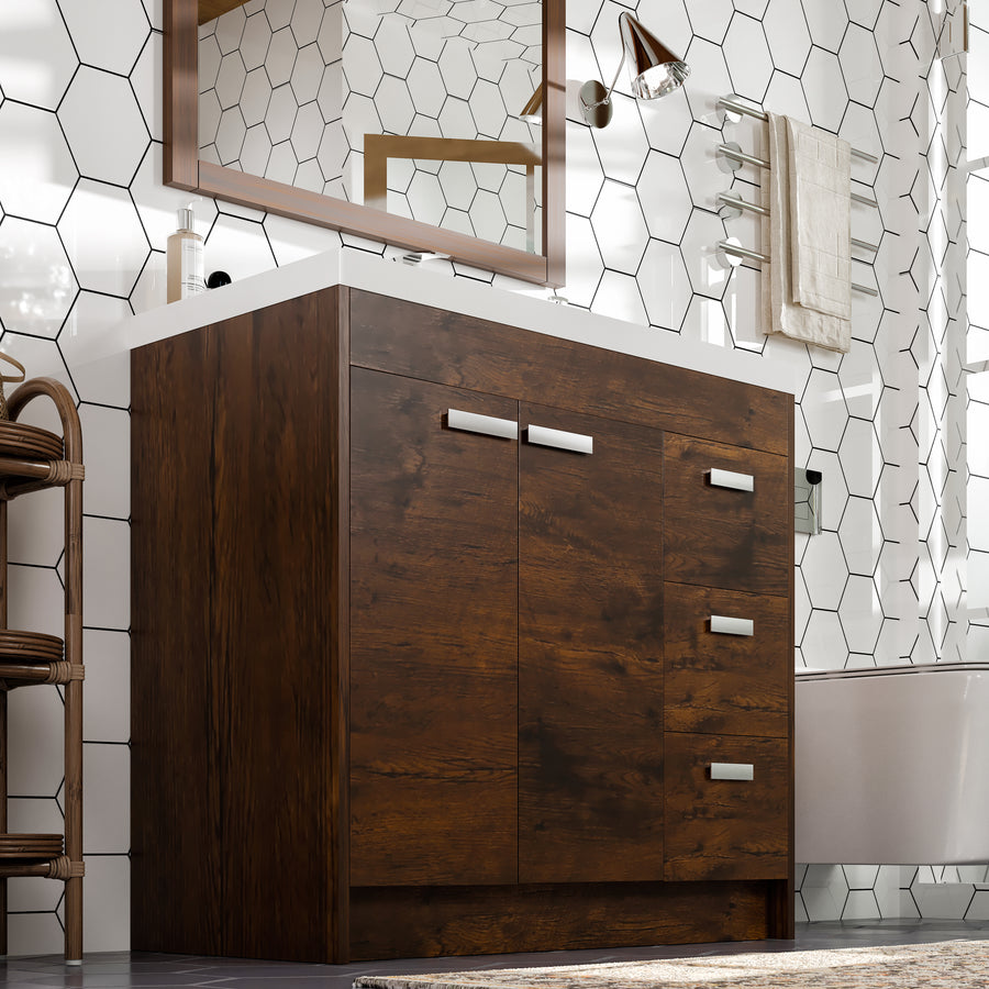 A modern bathroom with a dark wood vanity, white countertop, hexagonal white tile walls, a rectangular mirror, metal towel rack with towels, and a glimpse of a bathtub.