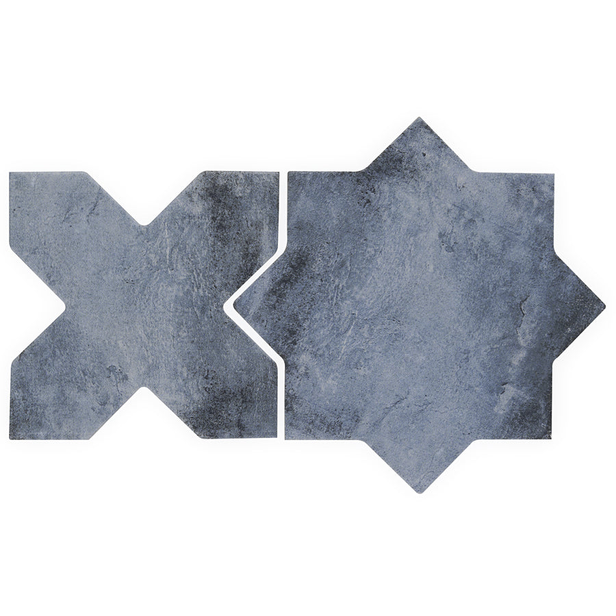 Two dark gray Morocco Star & Cross Porcelain Tiles display sharp X and eight-pointed star shapes, featuring premium design and a stone-like matte finish.