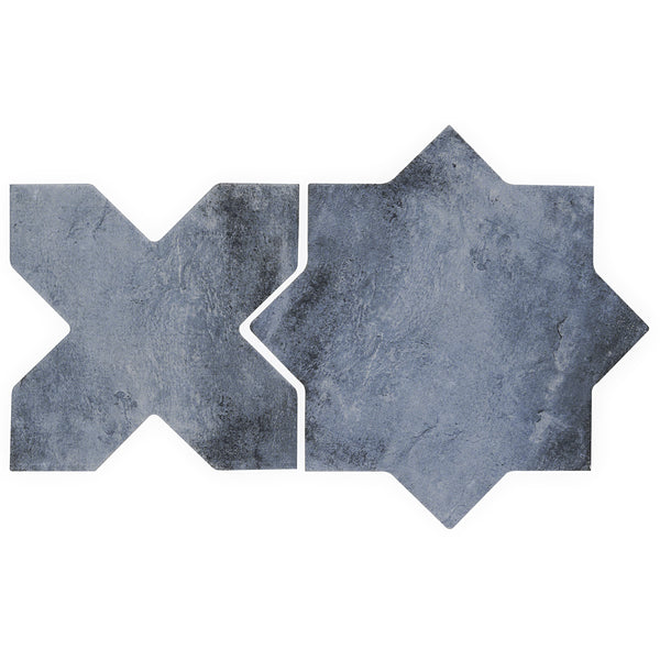 Two dark gray Morocco Star & Cross Porcelain Tiles display sharp X and eight-pointed star shapes, featuring premium design and a stone-like matte finish.