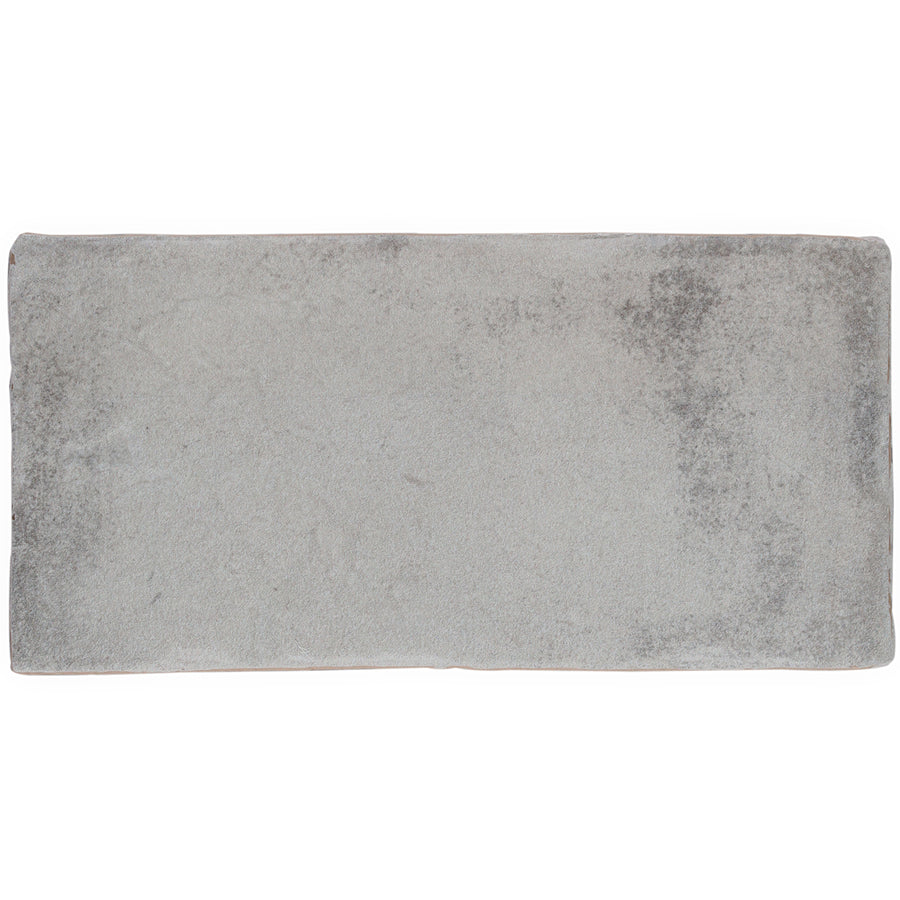A rectangular Morocco 4x8 white body ceramic tile with a soft, slightly mottled texture adds rustic allure to any space.