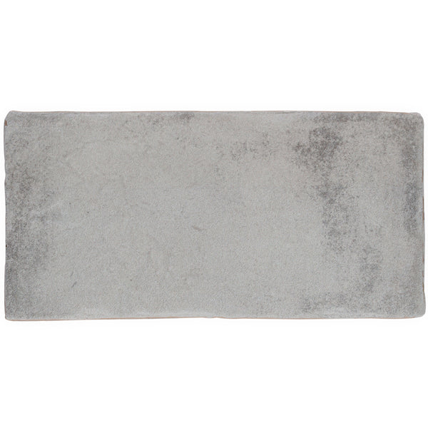 A rectangular Morocco 4x8 white body ceramic tile with a soft, slightly mottled texture adds rustic allure to any space.