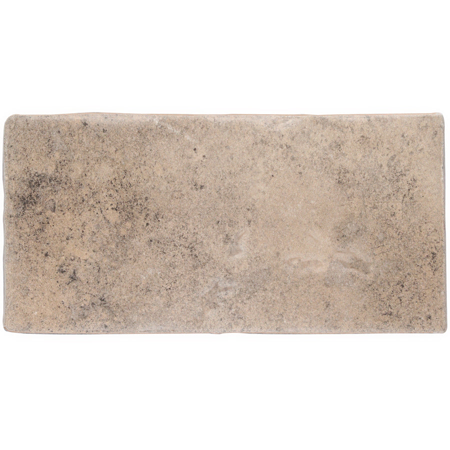 The Morocco 4x8 White Body Ceramic Tile features a rectangular shape, beige and brown tones, and a textured, mottled surface for rustic appeal.