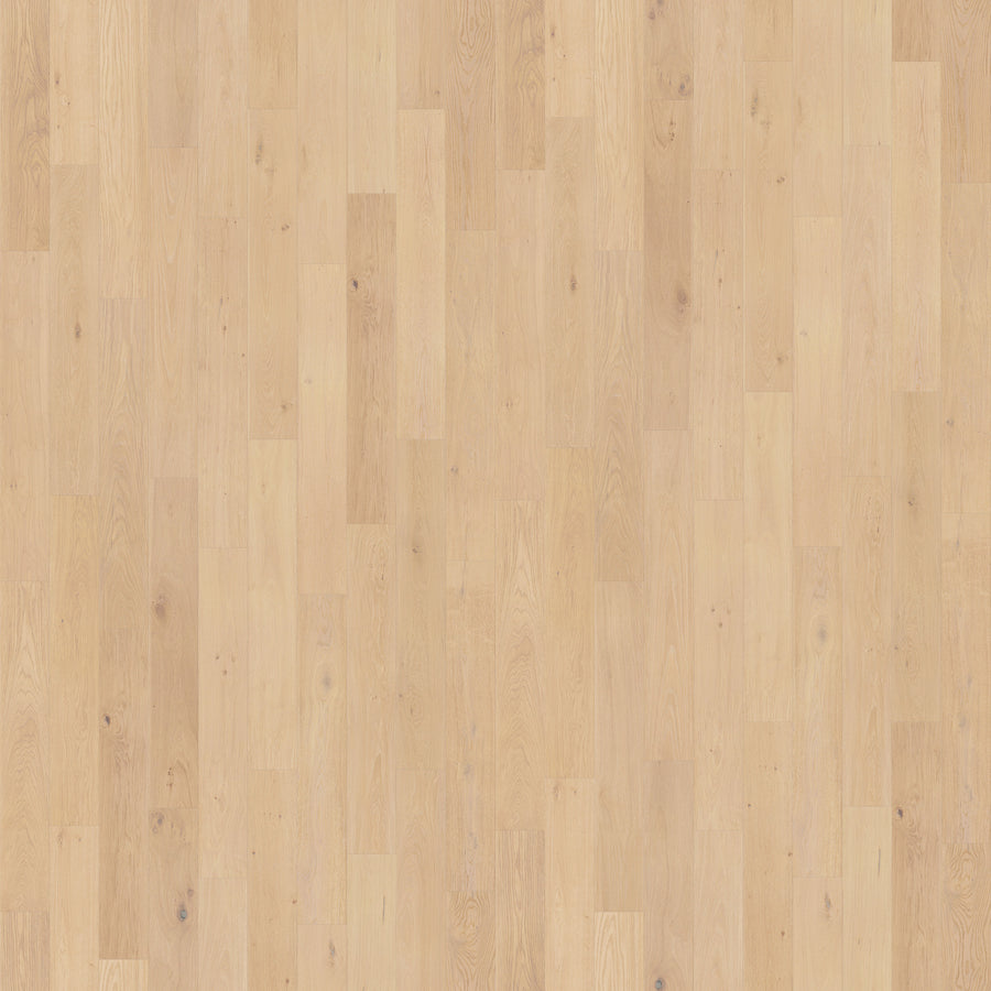 Pacifica 7 11/16" Waterproof Laminate in Southern Salt features a light tone with natural grain and subtle knots. The staggered planks offer a smooth, moisture-resistant surface for a clean, modern look.