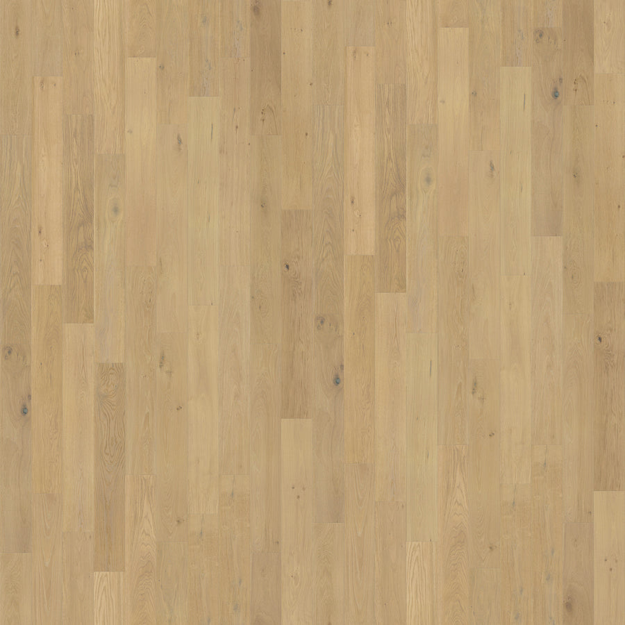 Pacifica 7 11/16" Waterproof Laminate in Carmel Crush features a natural grain with subtle knots, staggered planks, and a smooth matte finish that highlights rich tonal variations. Its moisture-resistant design ensures lasting durability throughout your home.
