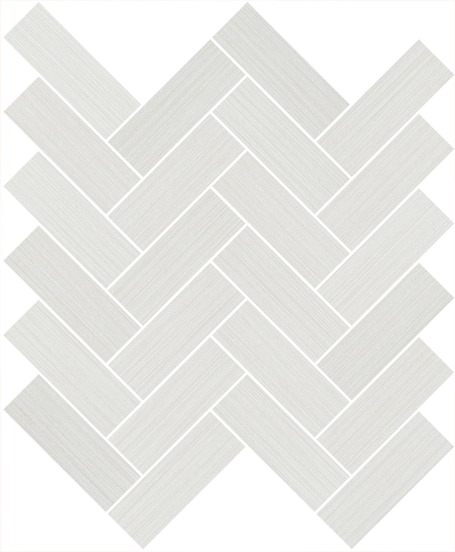 The Linea 1" x 4" Herringbone Mosaic Tile in Brighton features a white rectangular design with subtle linear texture, arranged in a zigzag pattern—ideal for bathroom walls or as a stylish kitchen backsplash.