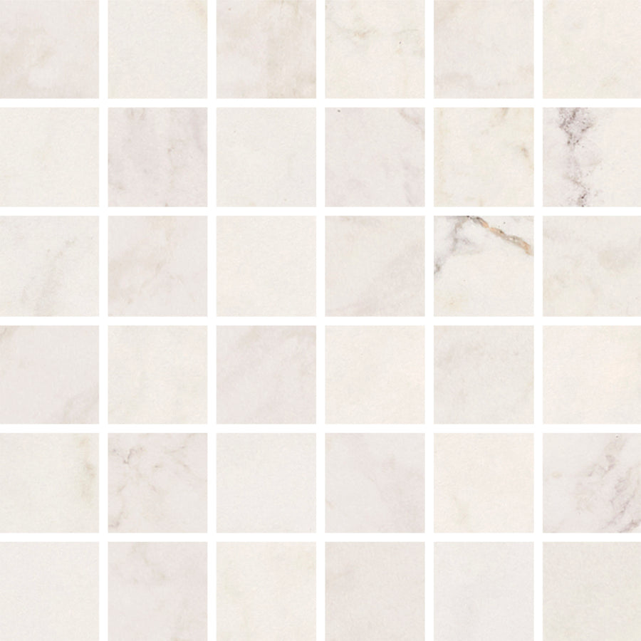 The Tuscany Ora 2" x 2" Mosaic Tile in Natural features a grid of square tiles with subtle gray and beige veining, separated by thin white grout lines for a clean, orderly look inspired by Mediterranean style.