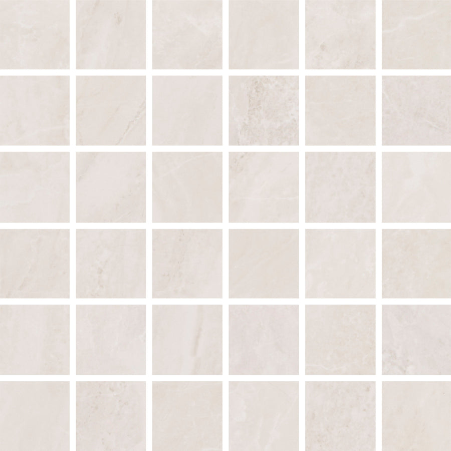 The Veil 2" x 2" Mosaic Tile in White Natural features a grid of light tiles with subtle marble veining. Thin white grout lines create a clean, neutral look, ideal for accent walls.