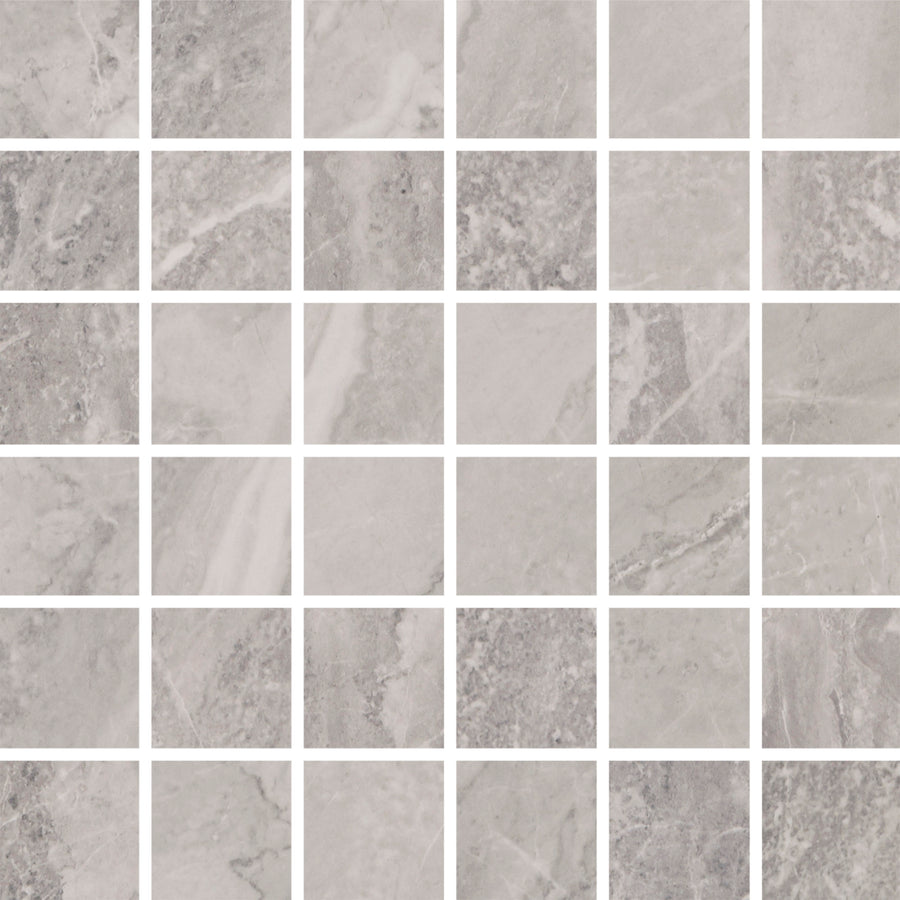Veil 2" x 2" Mosaic Tile in Mystic Natural features light gray, marbled squares with subtle color and veining variation, set in a grid with thin white grout—perfect for luxury radiant accent wall designs.