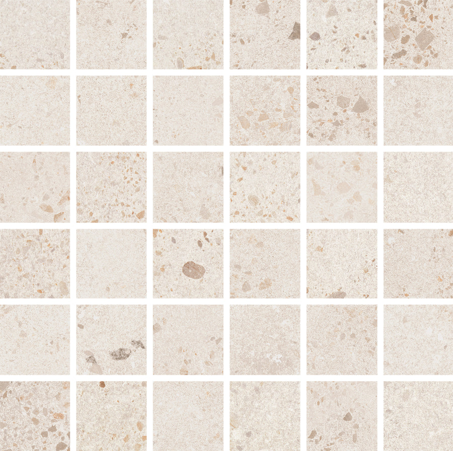 Strata 2" x 2" Mosaic Tile in Lava White features a grid of square tiles with subtle speckles and stone-like patterns. White grout lines and geometric layout offer a neutral, earthy look—ideal for sophisticated, stylish floors.