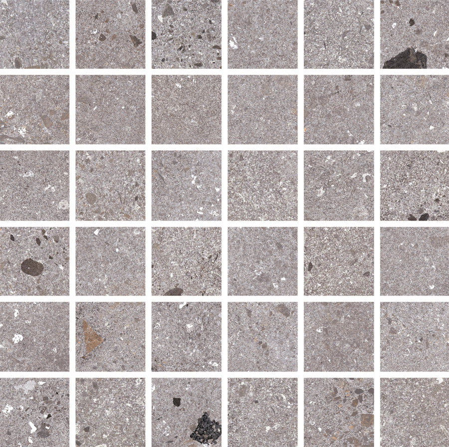 The Strata 2" x 2" Mosaic Tile in Cinder features 36 square gray tiles with a speckled, textured finish and subtle mineral accents, separated by white grout lines—ideal for adding geometric elegance to any backsplash or mosaic design.