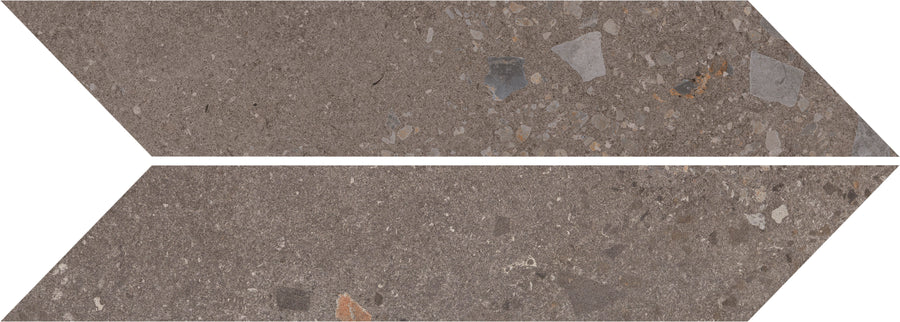 Two Strata Chevron tiles in Earthen color display geometric elegance with elongated, parallelogram shapes and a brown stone texture featuring subtle gray shades and colorful fragments on a durable surface.