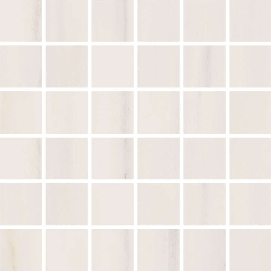 A grid of evenly spaced Lunara Stellar 2" x 2" tiles in Natural, with thin white grout lines, creates a clean and minimalist look—ideal for backsplashes or accent walls.