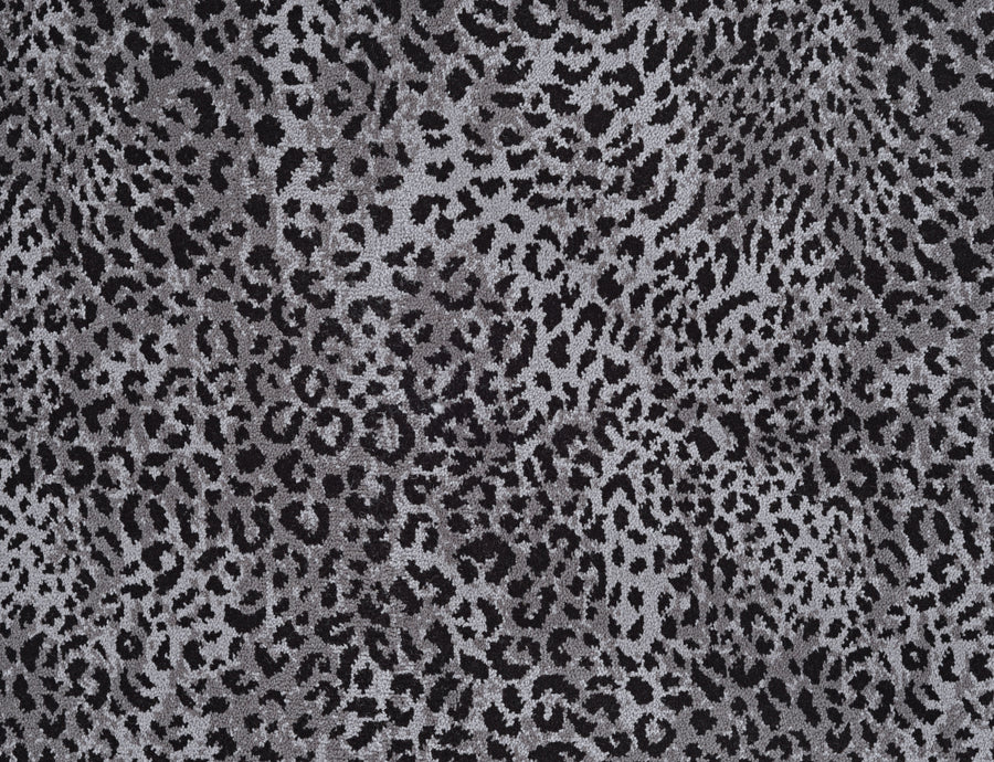 Close-up of Leopard Ax On Trend Carpet in Gray features irregular black and grey spots on a light grey background—a stylish, durable flooring inspired by natural leopard markings for modern interiors.
