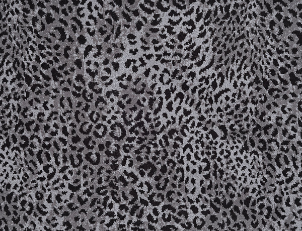 Close-up of Leopard Ax On Trend Carpet in Gray features irregular black and grey spots on a light grey background—a stylish, durable flooring inspired by natural leopard markings for modern interiors.