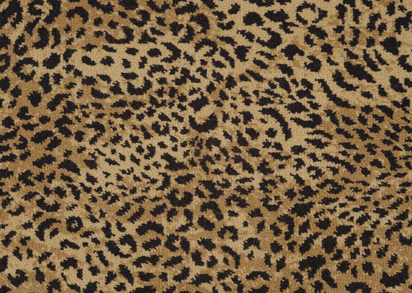 Close-up of the Leopard Ax On Trend Carpet in Natural, showcasing irregular black and dark brown spots on a tan background—ideal for adding bold style and durable flooring to any space.