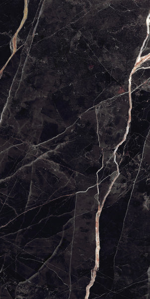 Dark marble surface with white and beige veins running diagonally and irregularly throughout, creating a natural, polished stone pattern.