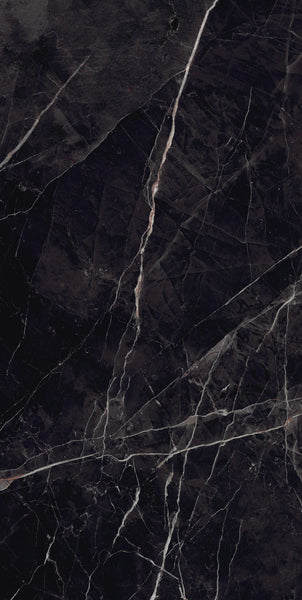Dark black marble surface with white and light gray veins running diagonally across, creating a natural, intricate pattern. The texture appears smooth and polished.
