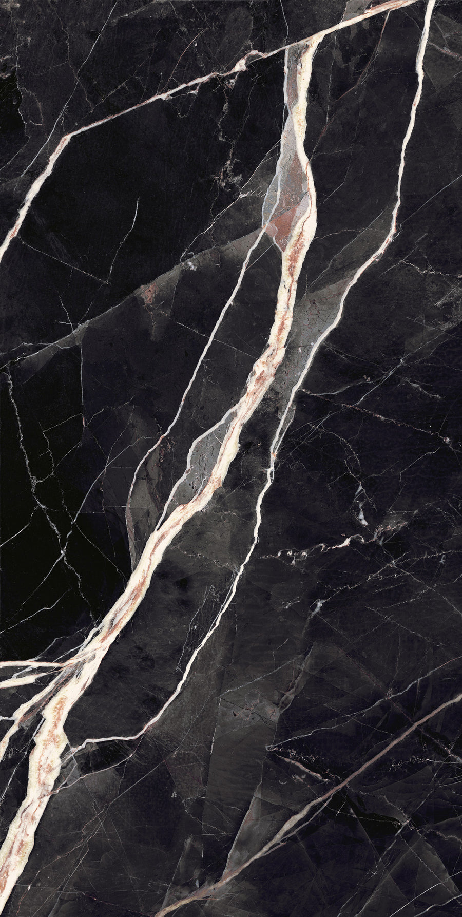 Dark marble surface with prominent white and light brown veining running diagonally across the image, creating a striking contrast against the black background.
