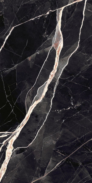 Close-up of a dark, black marble surface with prominent white and light beige veins running diagonally across, creating a striking, natural pattern. The texture appears smooth and polished.