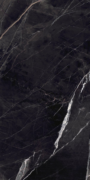Dark black marble surface with fine white and gray veining running diagonally and vertically across the stone, creating an elegant and natural abstract pattern.