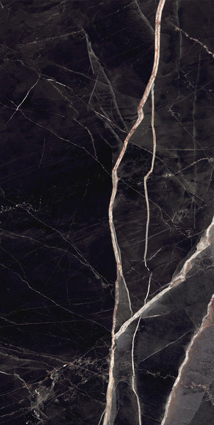Dark marble surface with thin, irregular white and light beige veins running diagonally across, creating a natural, polished stone texture.
