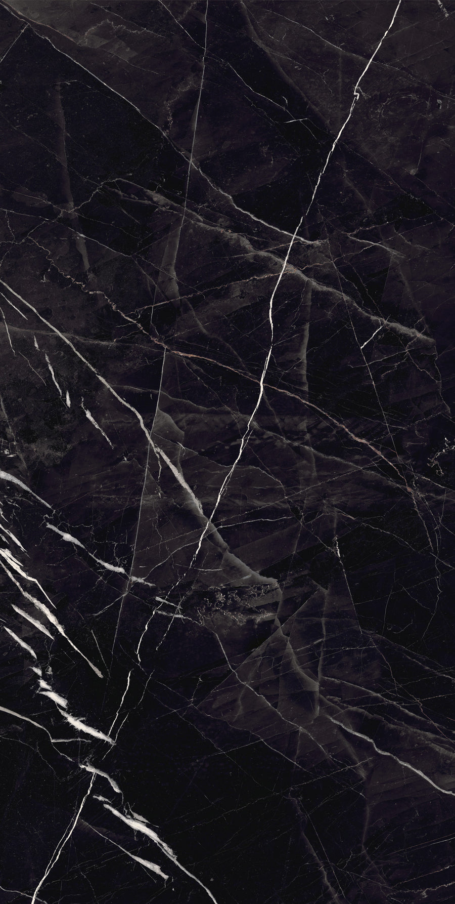 A close-up of dark black marble with white and gray veining patterns running diagonally and vertically across the smooth surface. The natural stone texture gives a polished, elegant appearance.