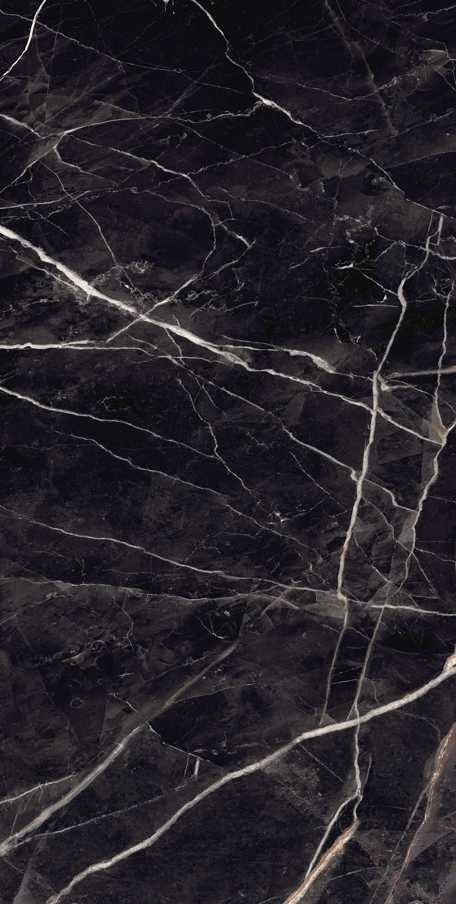 Dark marble surface with white and light gray veins running irregularly across it, creating a natural, dramatic pattern. The texture is polished and smooth, with fine details visible in the stone.