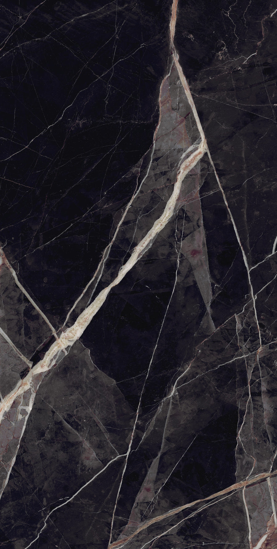 Dark marble surface with irregular white and light gray veins crossing throughout, creating a dramatic and striking natural pattern. The texture is glossy and polished, highlighting the contrast between the dark and light areas.