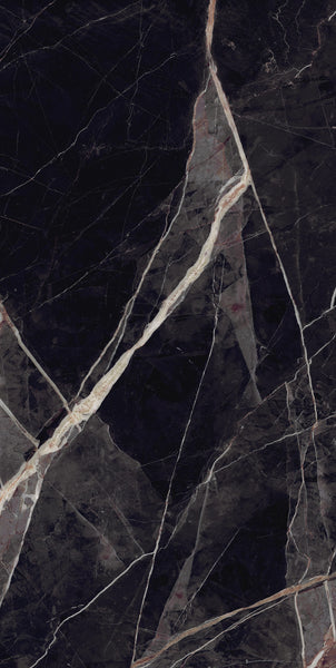Dark marble surface with prominent white and light beige veins running diagonally, creating a striking, natural pattern across the polished stone background.