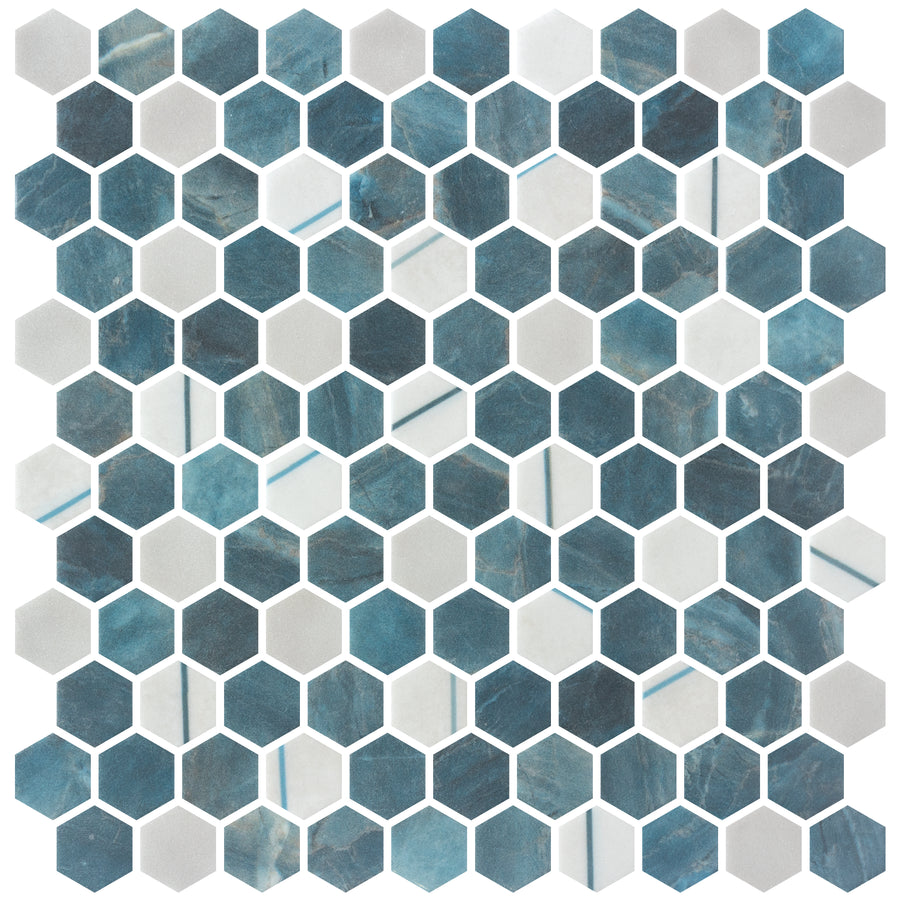 The Aragon Hills Hexagon Glass Mosaic Tile in Qassle Blu features alternating marbled blue and solid white hexagonal tiles with white grout lines, offering a bold geometric pattern inspired by classic Aragon Hills designs.