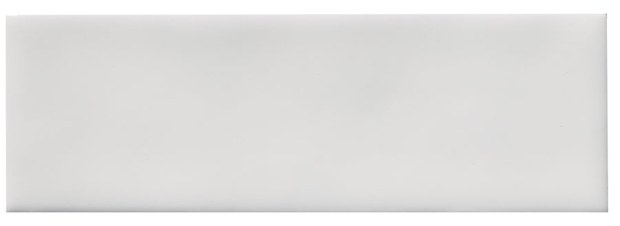 The Zephyr 2x6 Ceramic Tile features a plain, rectangular, white design with a glossy finish and smooth surface, inspired by Mediterranean style and handcrafted luxury.