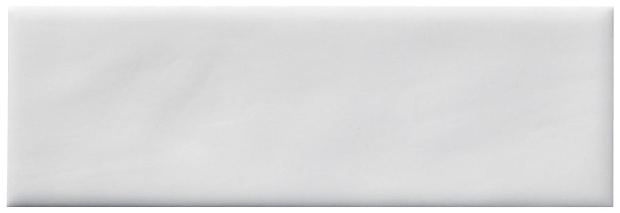 The Zephyr 2x6 Ceramic Tile features a plain, white rectangular shape with clean lines, offering the refined simplicity of handcrafted luxury and the timeless elegance reminiscent of Mediterranean style.