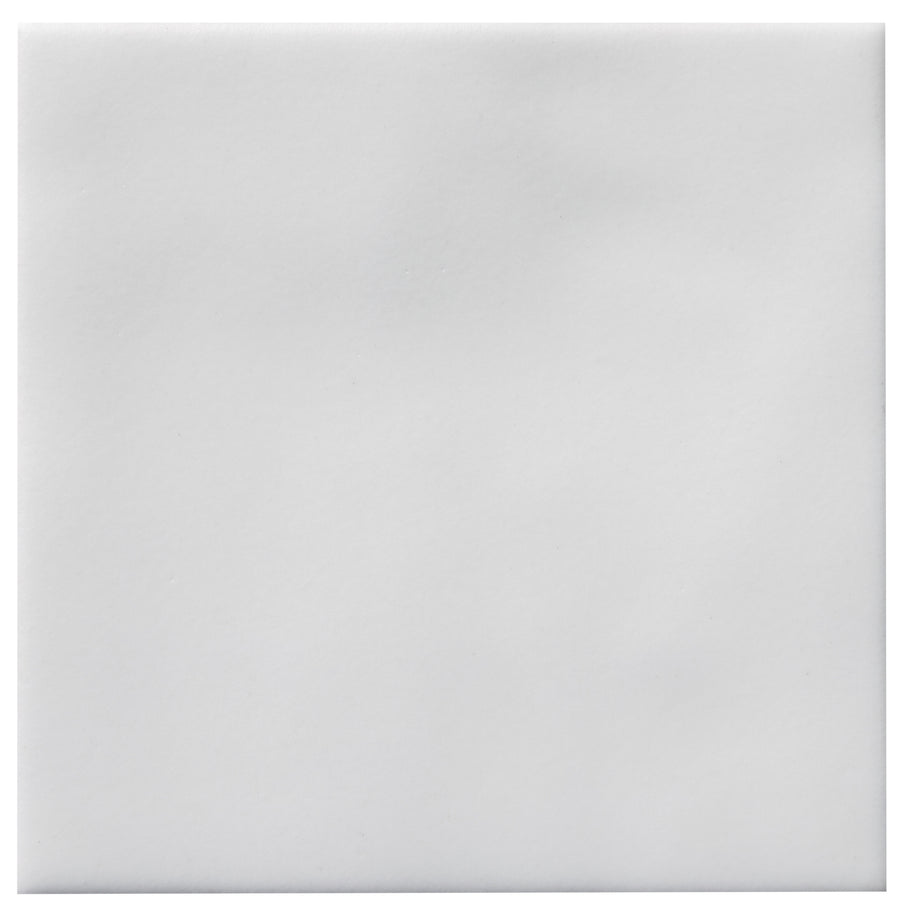 The Zephyr 4x4 Ceramic Tile features a smooth matte finish and subtle shading in plain white, offering understated elegance with a hint of Mediterranean style—perfect for refined, minimalist spaces.