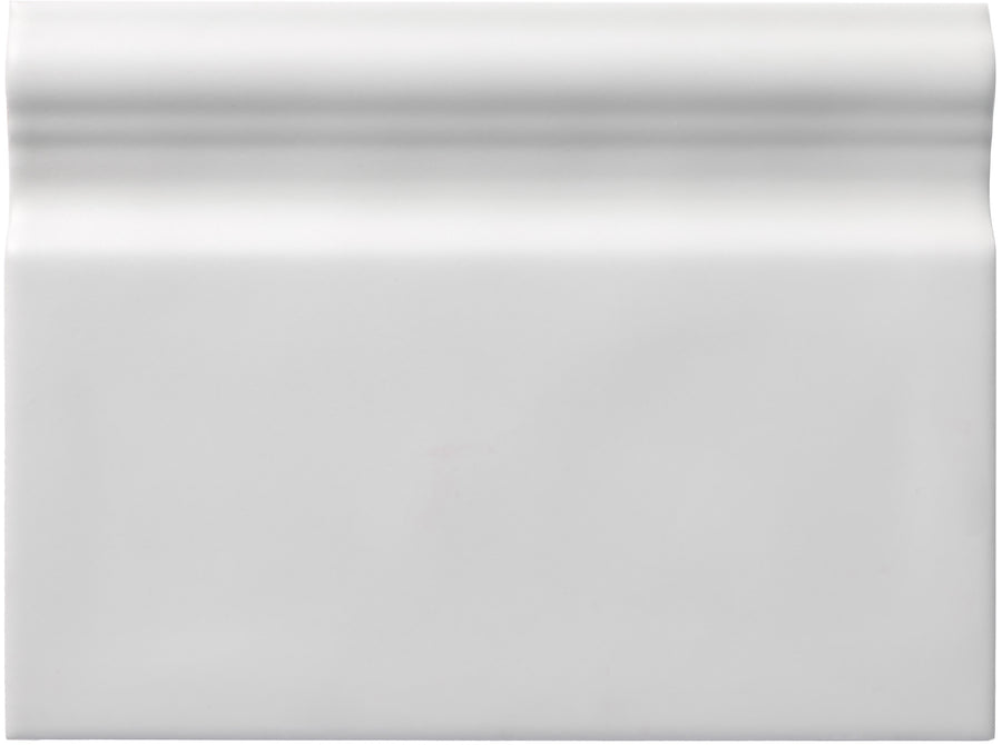 The Zephyr 6x8 Ceramic Baseboard features glossy white ceramic with a raised, rounded beveled top edge, offering handcrafted luxury that's perfect for Mediterranean baseboards and special-order collections.
