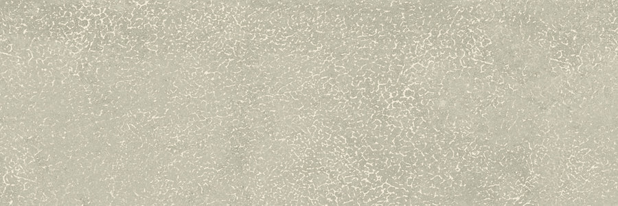 The Avanti 4x12 Glazed Porcelain Tile features a light gray, slightly rough matte surface with a subtle cracked pattern that evokes weathered concrete, offering a calming and uniform textured aesthetic.