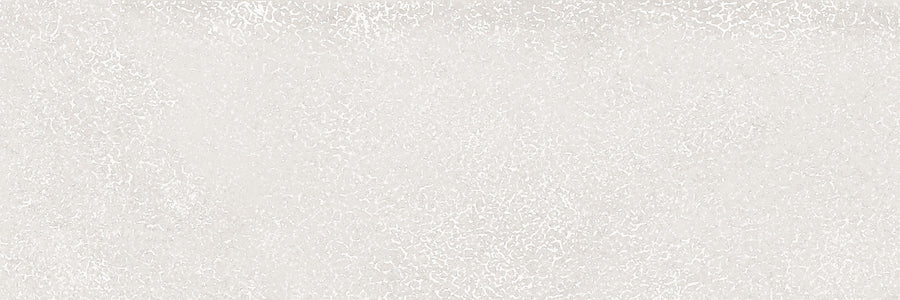 A light gray, subtly speckled surface resembling concrete offers a calm, neutral background that beautifully complements Avanti 4x12 Glazed Porcelain Tile with its soft texture and refined aesthetic.