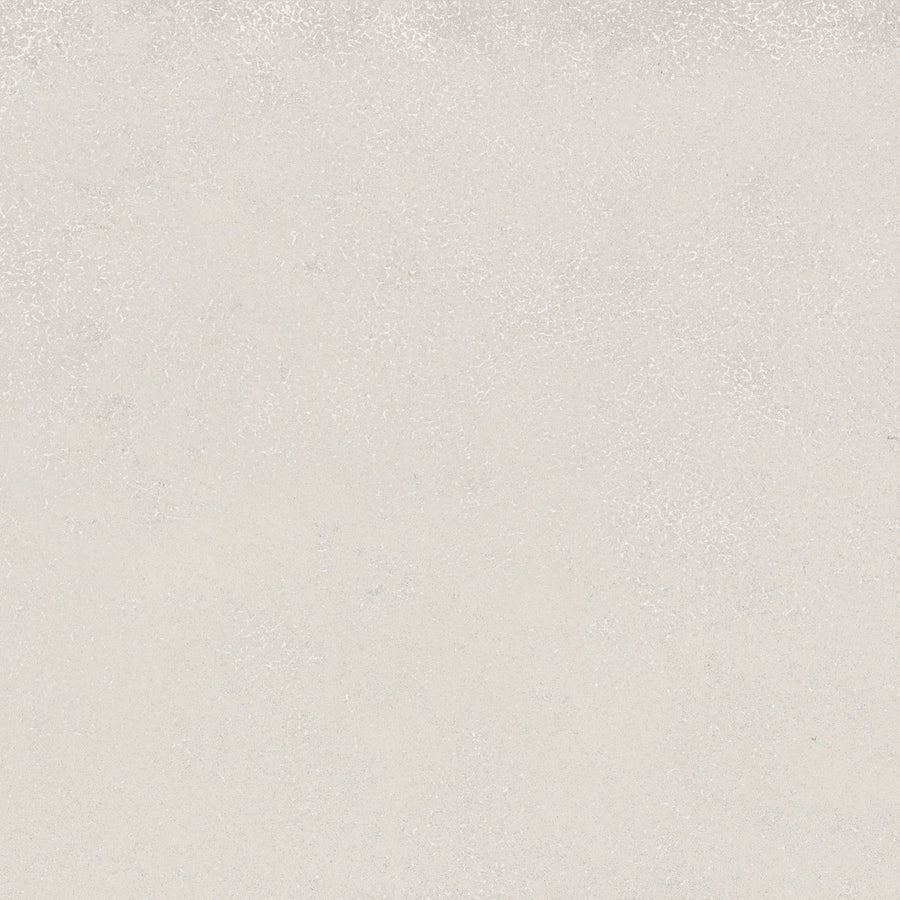 The Avanti 12x12 Glazed Porcelain Tile features a flat, light gray surface with a slightly rough texture and subtle speckles, ideal for creating a calming aesthetic and tranquil atmosphere in any space.